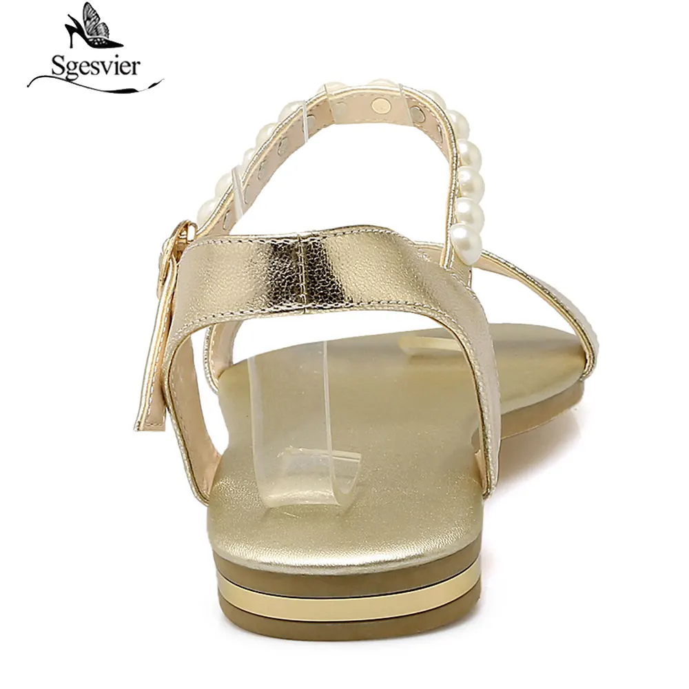 Женские сандалии из натуральной кожи на плоской подошве с ремешком и пряжкой |