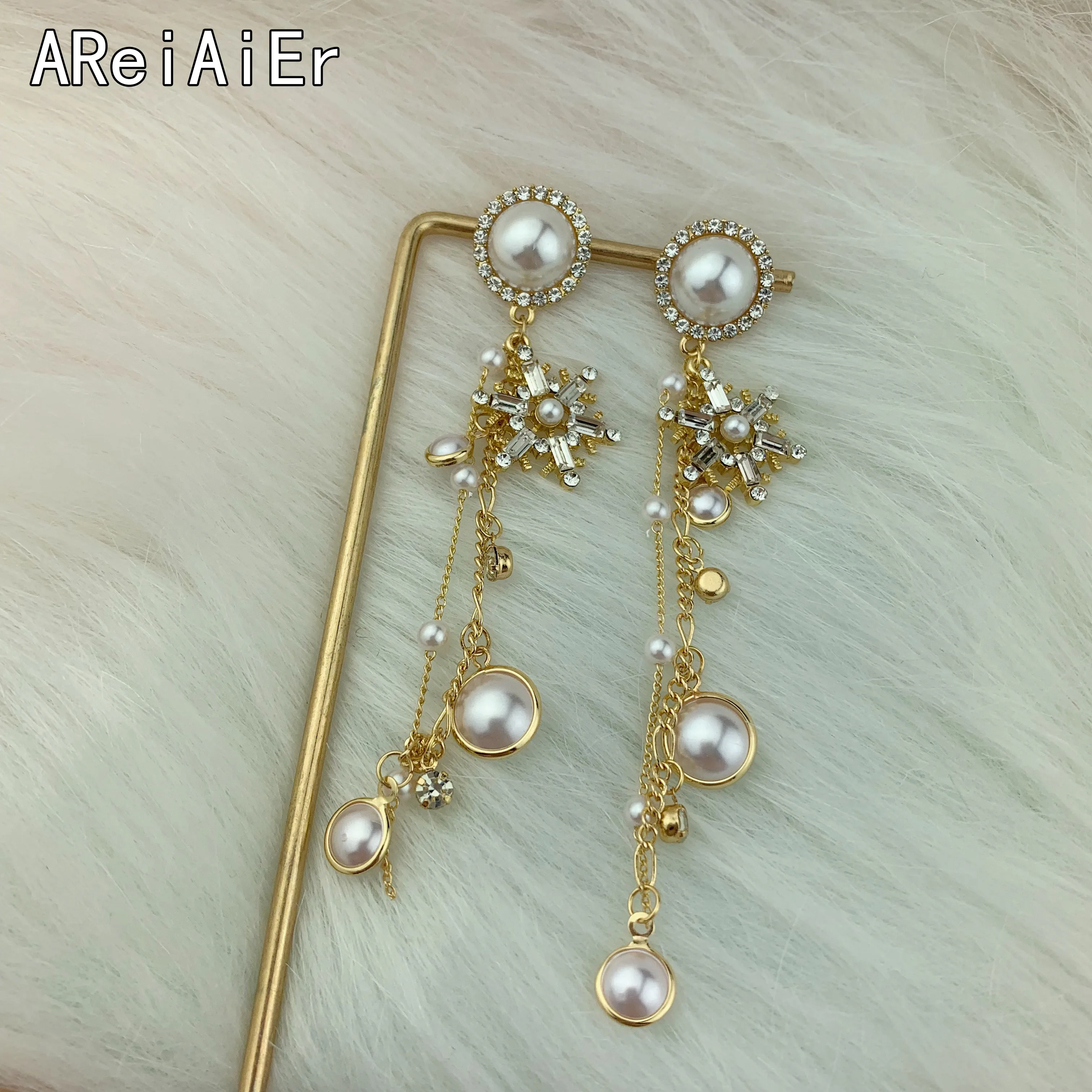 Корейская версия S925 Серебряные иглы Снежинка жемчуг личности длинные кисточки модные яркие серьги-гвоздики женские серьги