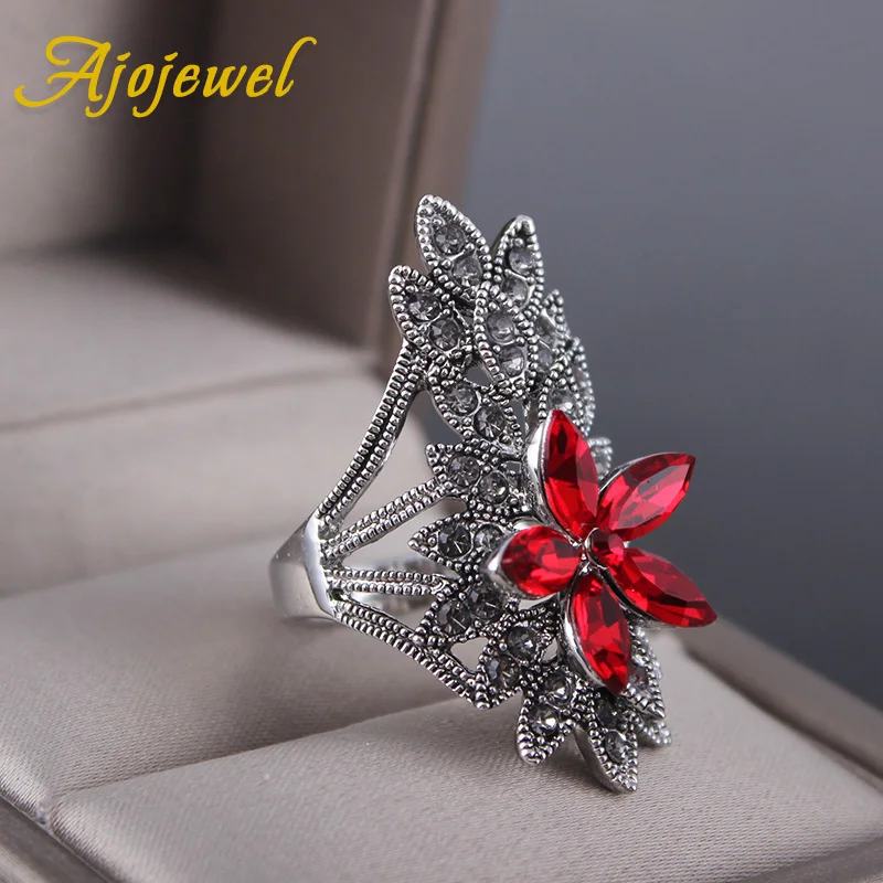Женское кольцо с цветком Ajojewel черное красным кристаллом большие стразы