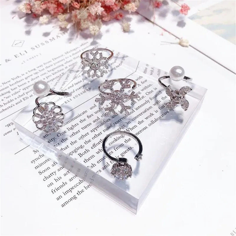 

Tiktok snowflake ring female Japanese Pearl Korean hipster personality rotating ring girlfriends open adjust Silver Color ring