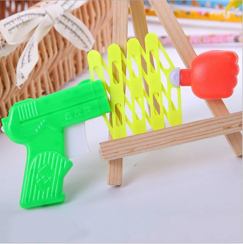 Лидер продаж дешевый выдвижной пистолет с кулаком упругая игрушка смешные