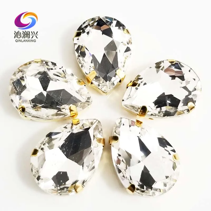 

Free shipping Golden bottom white teardrop shape High quality AAA Glass Crystal sew on claw rhinestones,Diy Clothing accessories