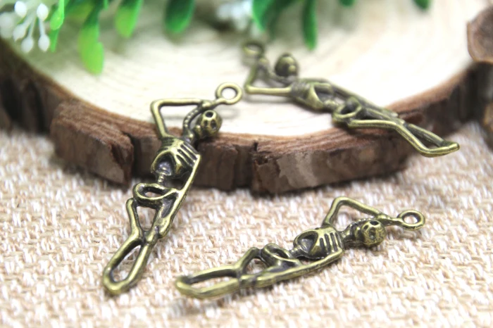

15pcs Skeleton Charms,Antique Bronze Skeleton Hanging on Rope Charm Pendants 12x42mm