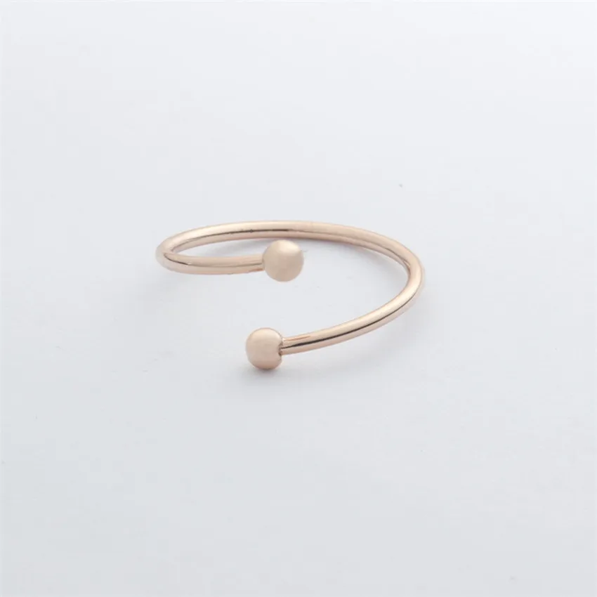 Женское и мужское мини кольцо с двумя шариками розовое золото минималистичные