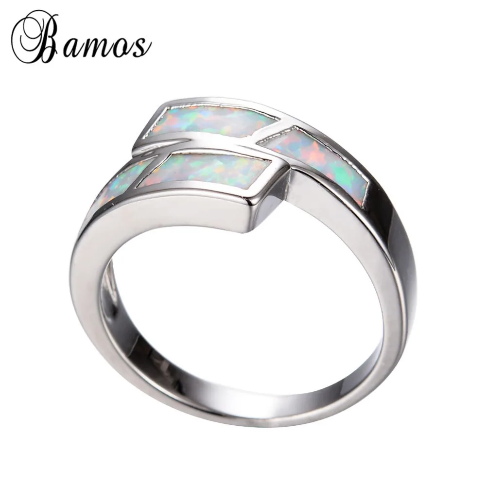 Кольцо женское и мужское из белого золота с радужным огненным опалом | Украшения