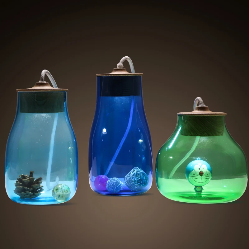 

Creative glass jar blue light green table lamp. kid room cartton bottle desk lamp reading light. Art decoration lighting fixture