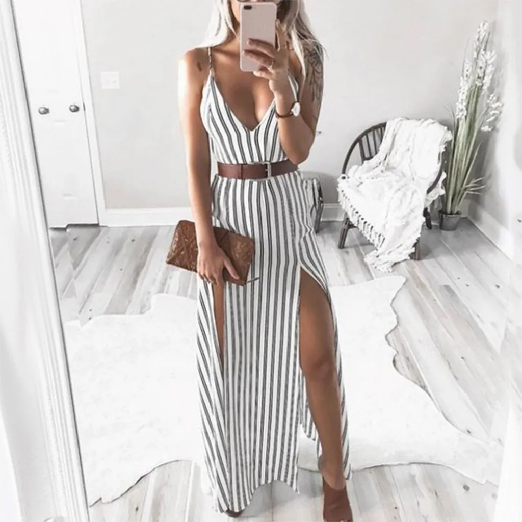 Женское длинное платье без рукавов с глубоким v вырезом и поясом в