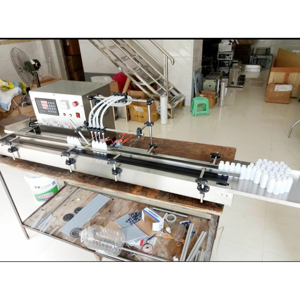 Новая машина для наполнения жидкостей с четырьмя головками полностью