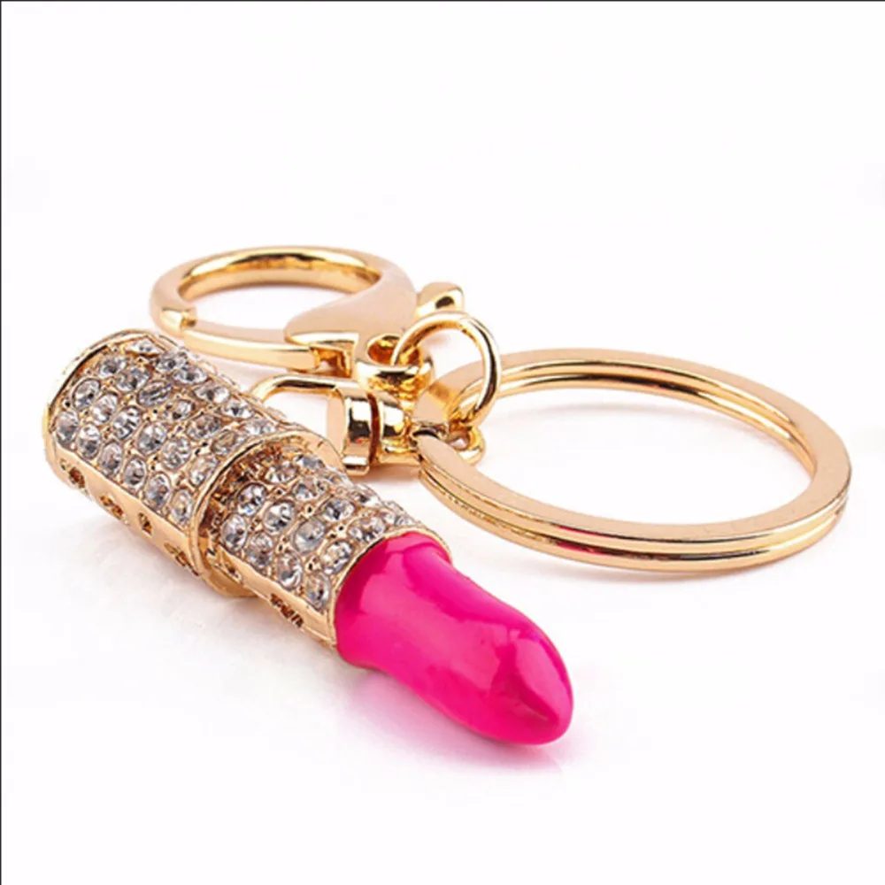 Женский брелок с золотым кулоном помада со стразами |