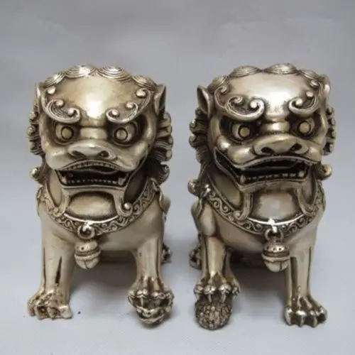 

A Pair of Chinese Tibetan Silver guard Foo Dogs Lion statues