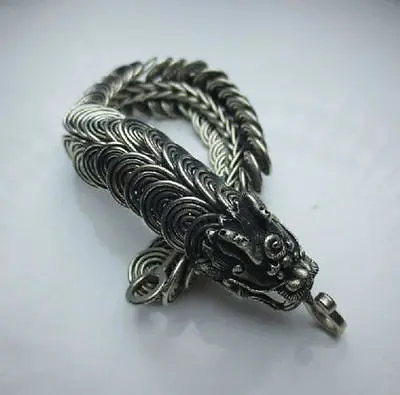

Elaborate Chinese Miao silver dragon statue bracelet