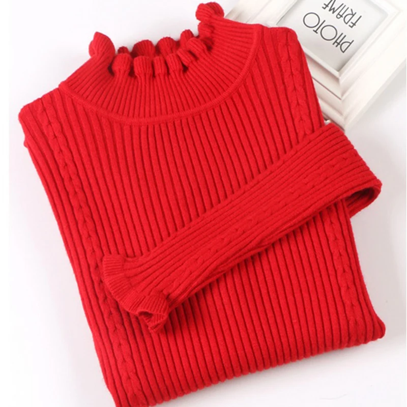 Женский свитер с оборками укороченный облегающий высоким воротником и длинным