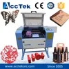

Высококачественный мини лазерный гравировальный станок цена AKJ6040