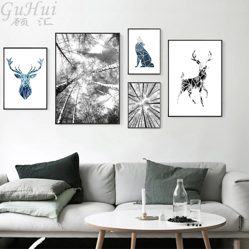 Постер на холсте с изображением черно белых деревьев и животных олени голубой