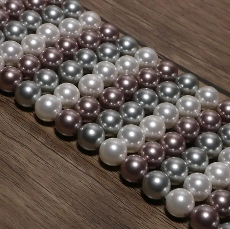 Бусины из натуральных глубоководных моллюсков смешанные с шариками-моллюсками