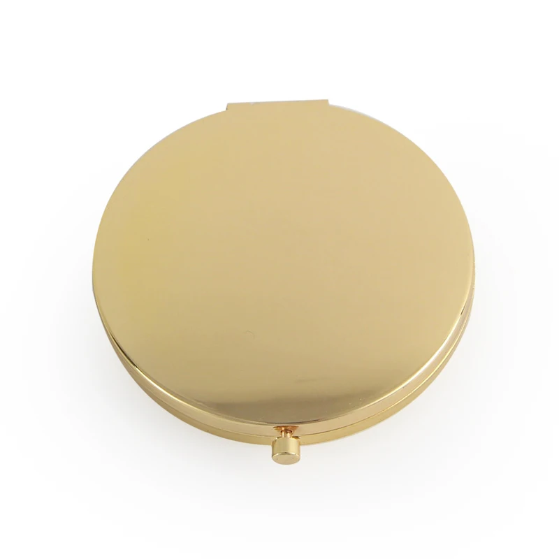 Компактное косметическое зеркальце светло-золотого цвета с прозрачной