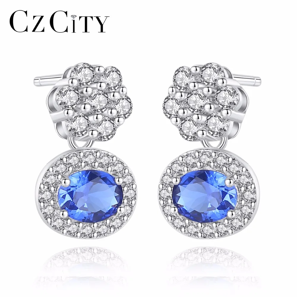 

CZCITY New Blue Oval Topaz Stud Earrings With Solid Miniature White Zircon Flowers 925 Sterling Silver Fine Jewelry For Women
