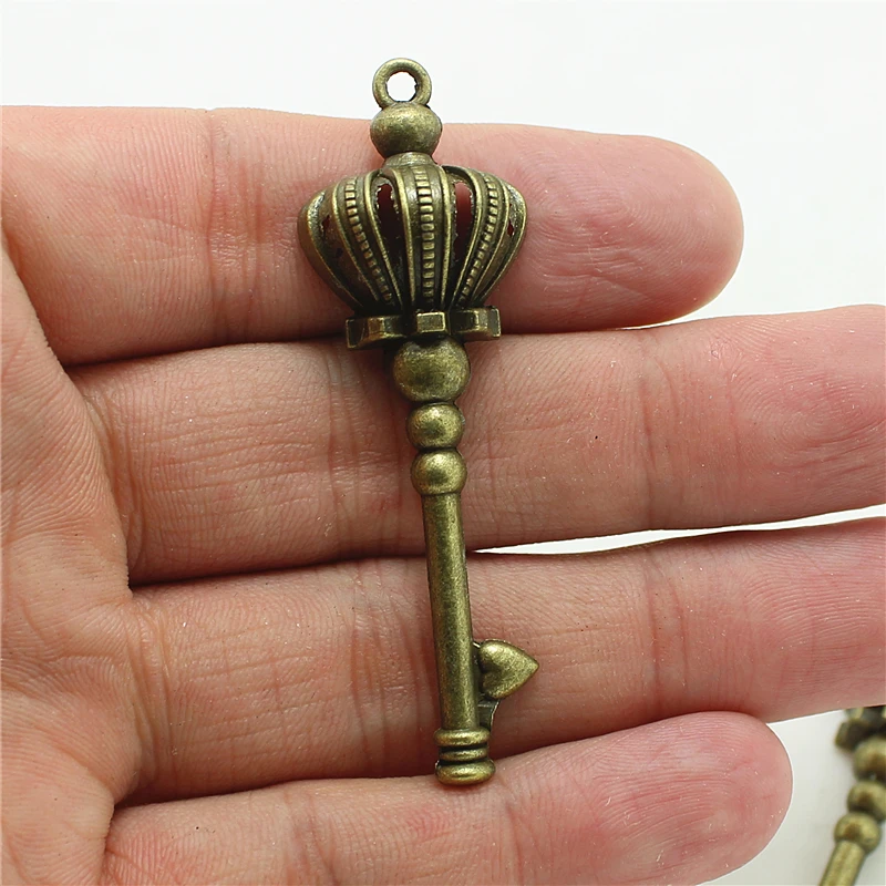 

Sweet Bell 15pcs 18*57mm crown Key shaped Charm bronze Vintage Metal Zinc Alloy Fine Trendy Keys Pendant Charms Jewerly 0965