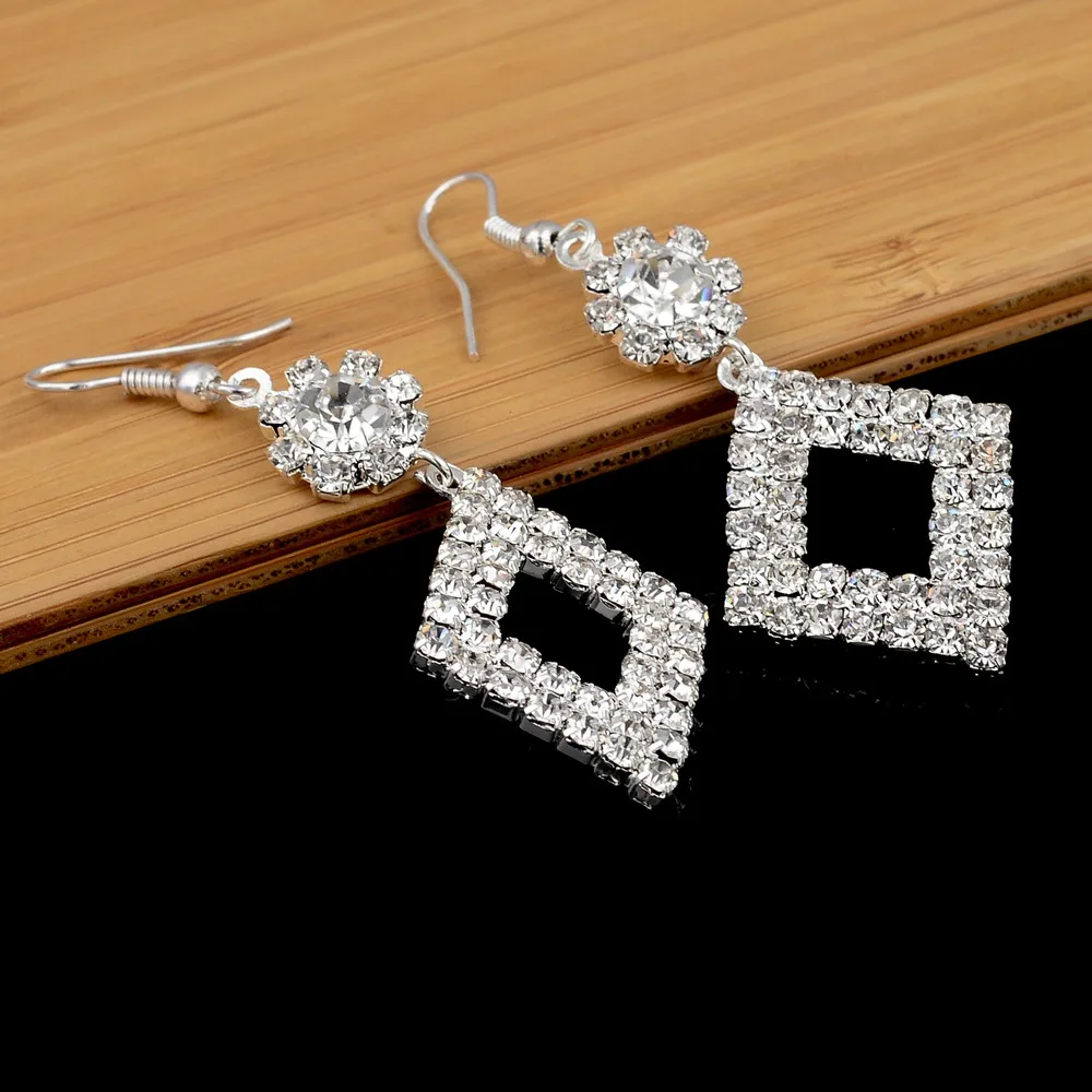 Женские серьги-подвески с кристаллами серебристого цвета | Украшения и