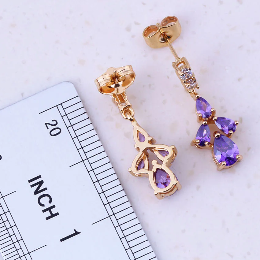 Привлекательные висячие серьги фиолетового цвета с кристаллами желтого золота