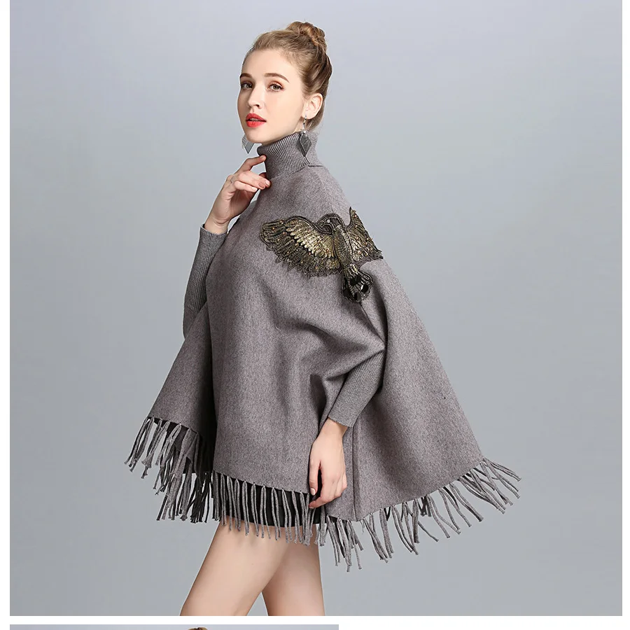 ZDFURS* Autumn Winter Long Knitted Women Eagle Appliqued Sweater Fashion Long Batwing Sleeves High Neck Stole Tassel Poncho