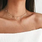 Женская короткая цепочка с кулоном в виде крошечных звезд