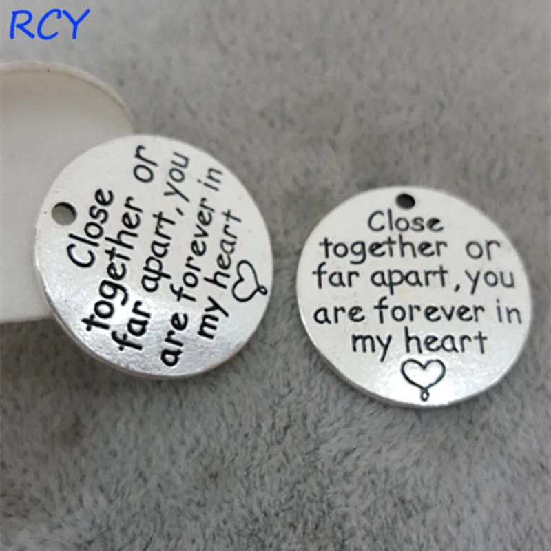 

Top Quality 20 Pieces/lot 23mm Round Disc Letter Printed close together or far apart you are forever in my heart charms