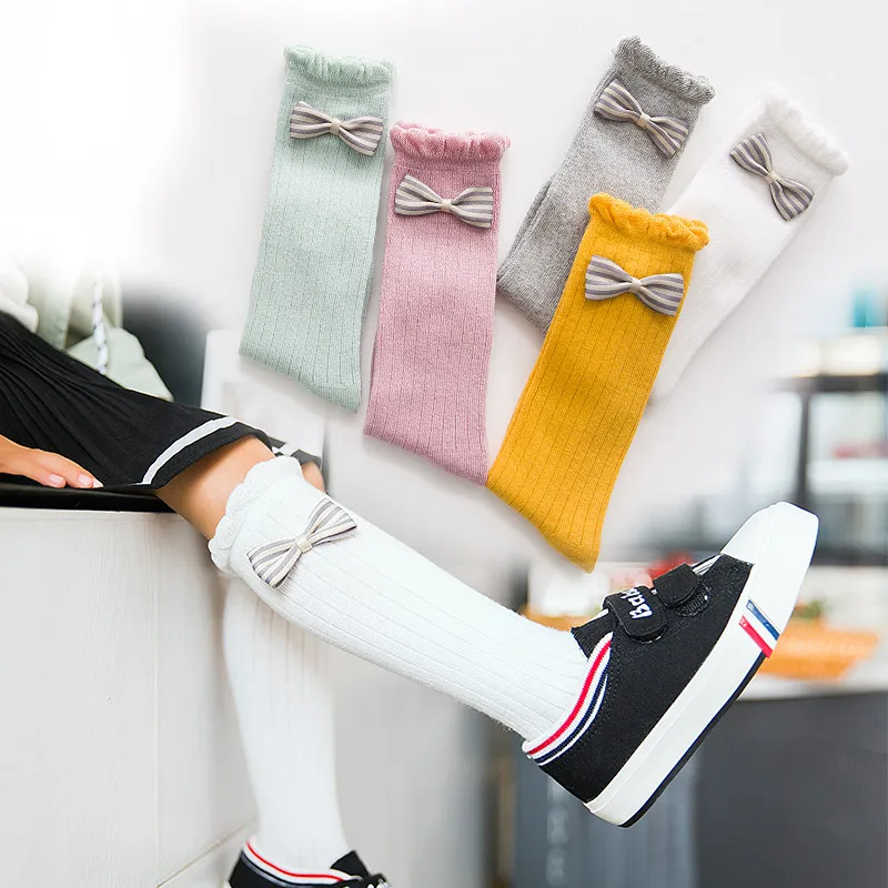 

Autumn and winter new children socks 2 4 8 11 year old female baby cotton pile heap socks bow bow princess long tube socks