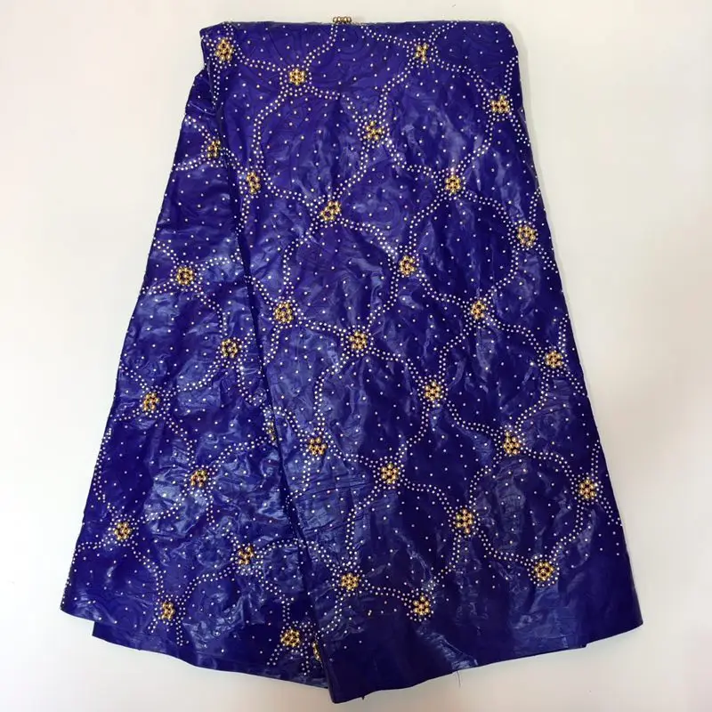 Красная африканская ткань для вечернего платья вышитая бисером Getzner с золотом