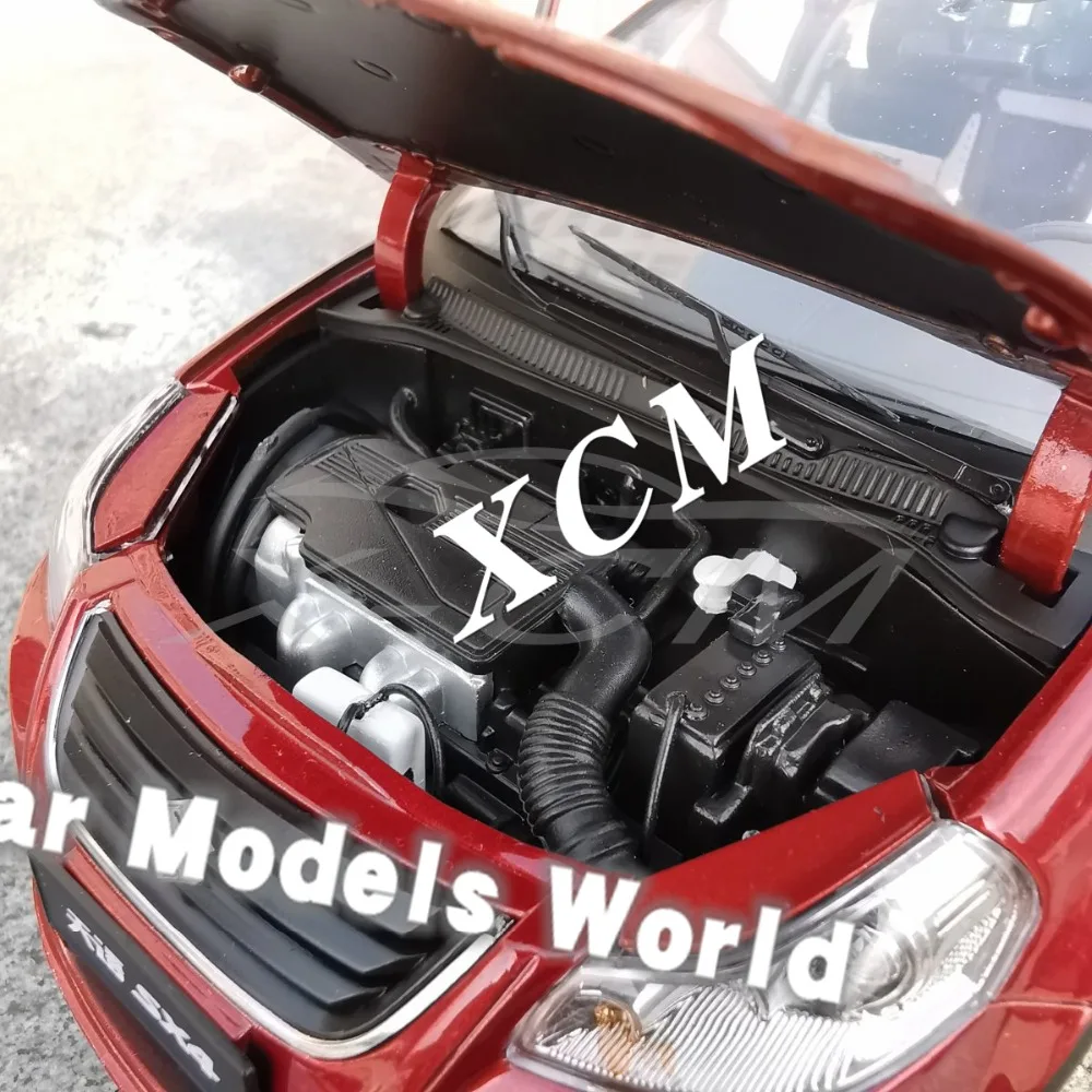 Модель литая автомобиля для кроссовера SX4 (оранжево красный) 1:18 + небольшой