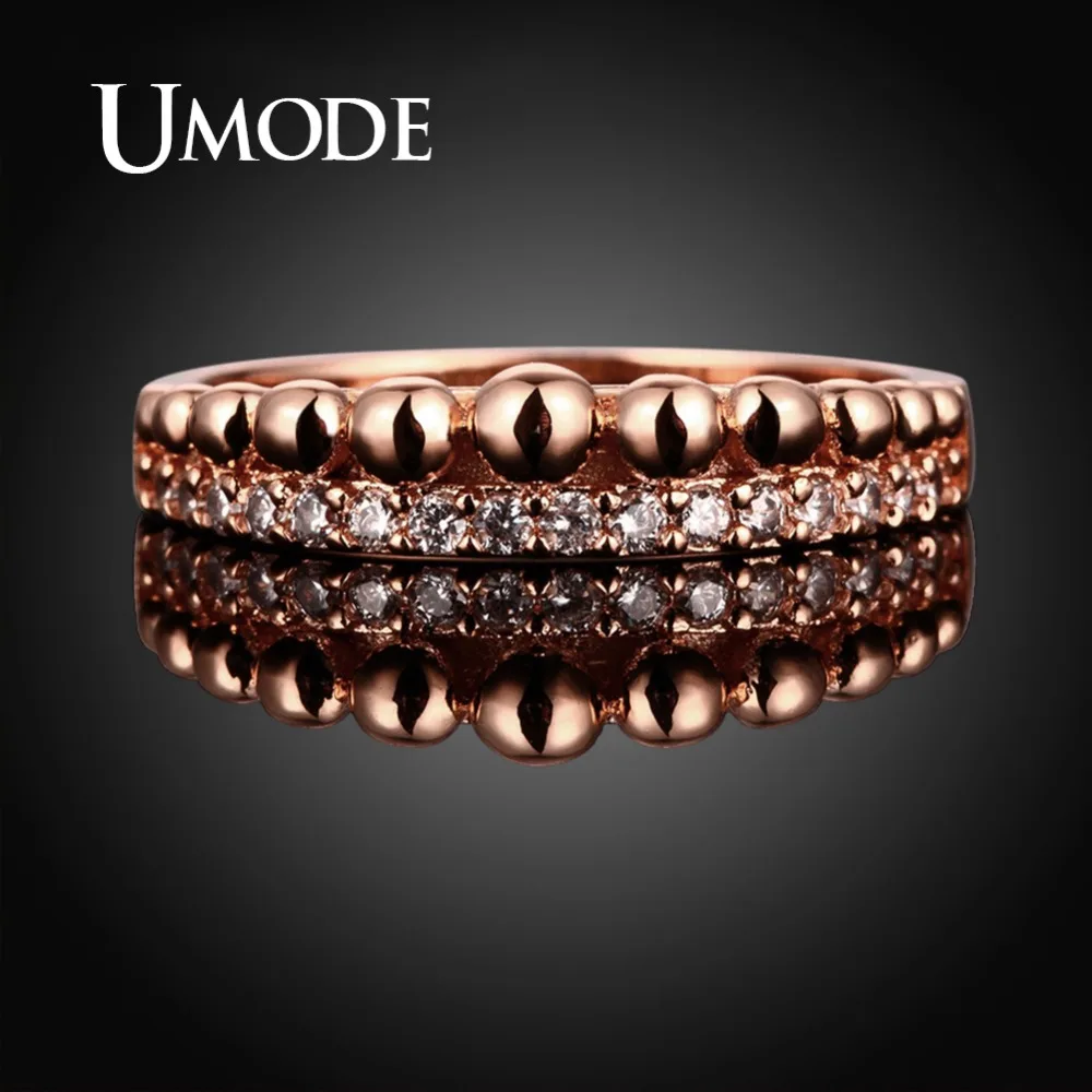 Кольцо женское из розового и белого золота с прозрачными круглыми