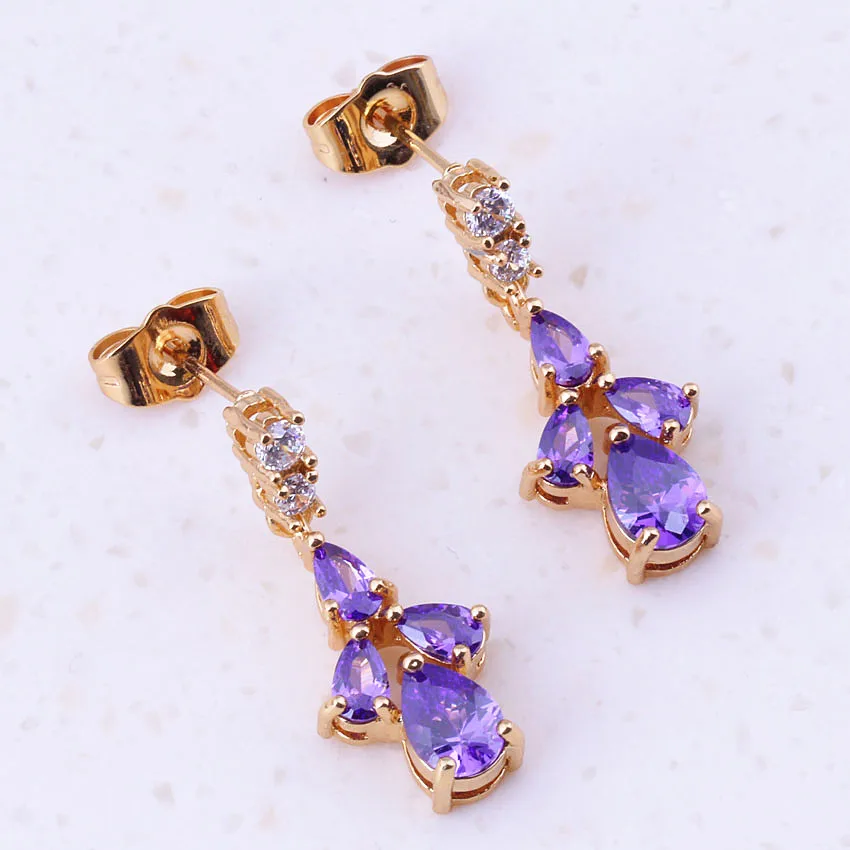 Привлекательные висячие серьги фиолетового цвета с кристаллами желтого золота