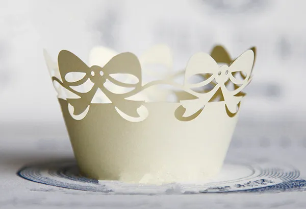 

Free Shipping light yellow bow lace cupcake wrapper paper laser muffin cake cup cups liners wedding wrappers decorating supplies