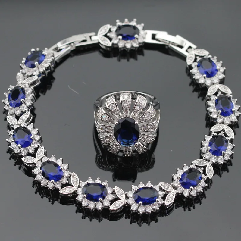 Женский серебряный ювелирный набор в форме цветка темно синий кристалл белый