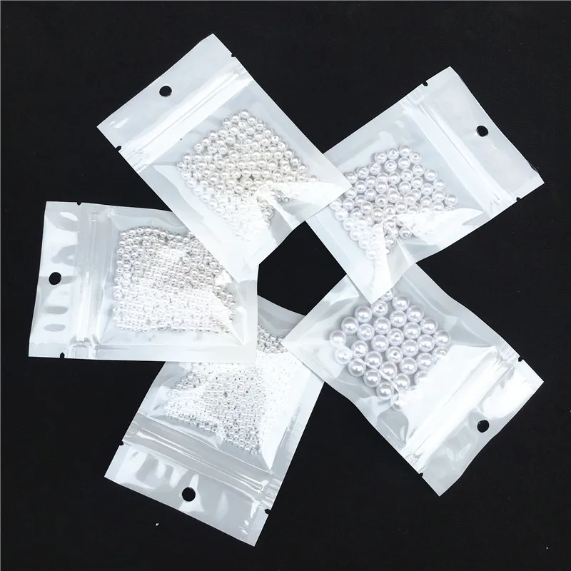 Искусственный жемчуг из АБС пластика белый круглый с отверстиями для творчества