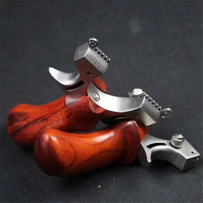 

Hunting Slingshot Stainless Steel Catapult + Wood Handle Outdoor Precise Shooting with 1pc Flat Rubber Band 2019 New