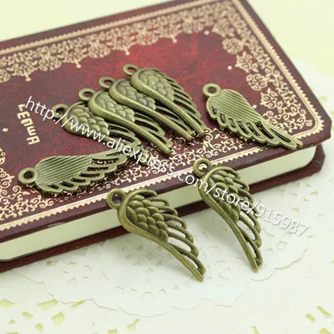 

Sweet Bell Wholesale 40pcs/lot 13*33mm Antique Bronze Metal Alloy Angel Wings Charms Jewelry Wings Charms D0259