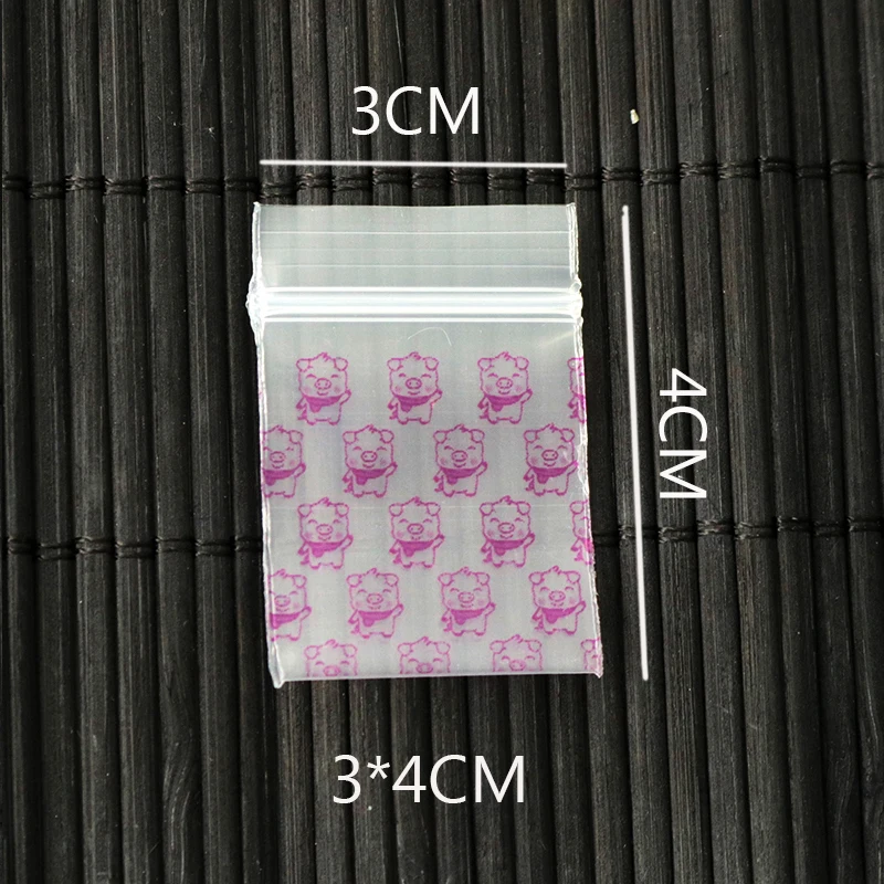 

Hot Sale 300pcs 3x4cm Mini Self Sealing Zip Lock Plastic Bags Pink Pig Pattern Transparent Ring Jewelry Packaging Bags