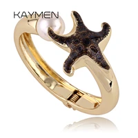 newest unique desgin starfish shape inlaid imitation pearl bangle cuff bracelet for girl golden plated top quality bangle