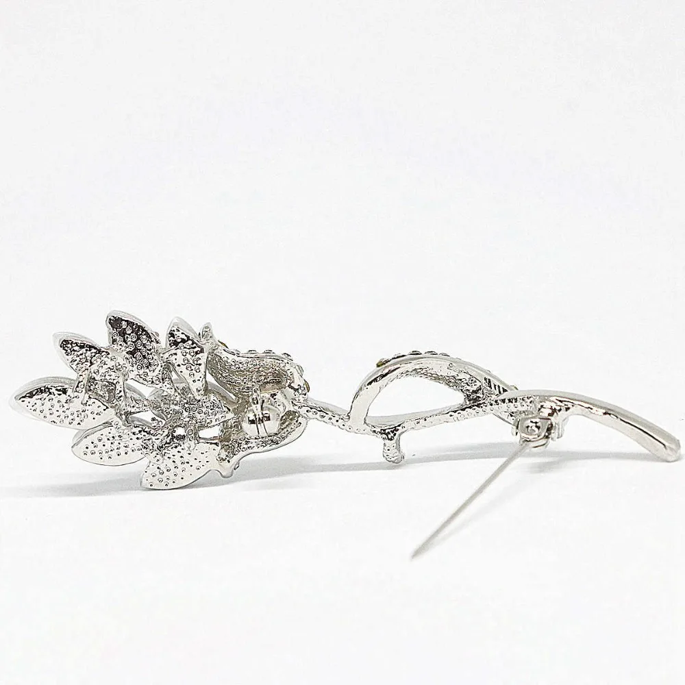 Брошь с длинным цветком белые хрустальные цветные кошачьи глаза изысканные