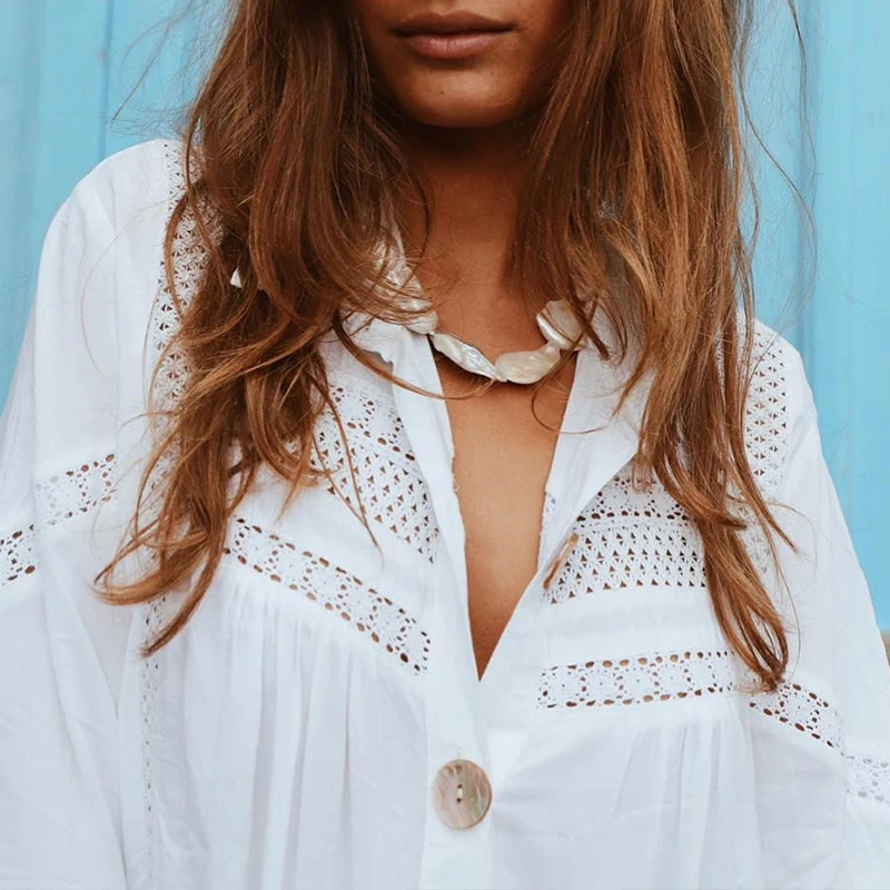 BerryGo Sexy Long sleeve beach cover up white blouse women hollow out female cotton shirts Holiday swimsuit cover-up tops |