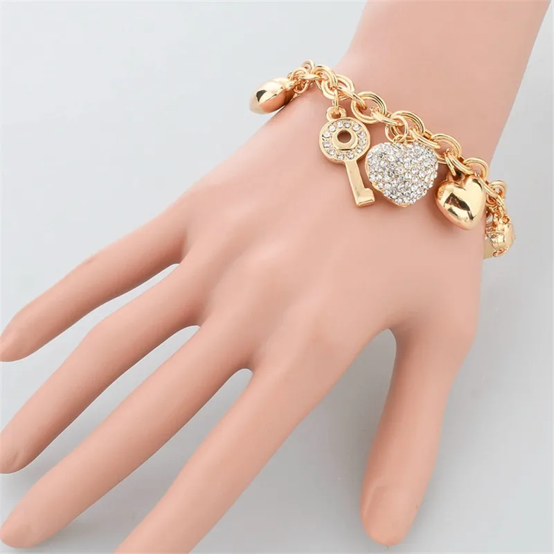 Женский браслет attrattto LOVE золотого цвета с сердечком и шармами SBR140221|bracelets for|heart charm