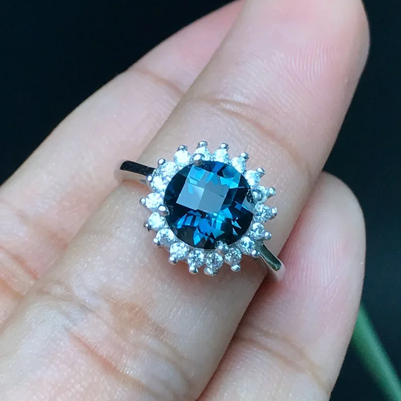 

KJJEAXCMY fine jewelry 925 sterling silver inlaid with natural blue topaz ring miniature with exotic florets