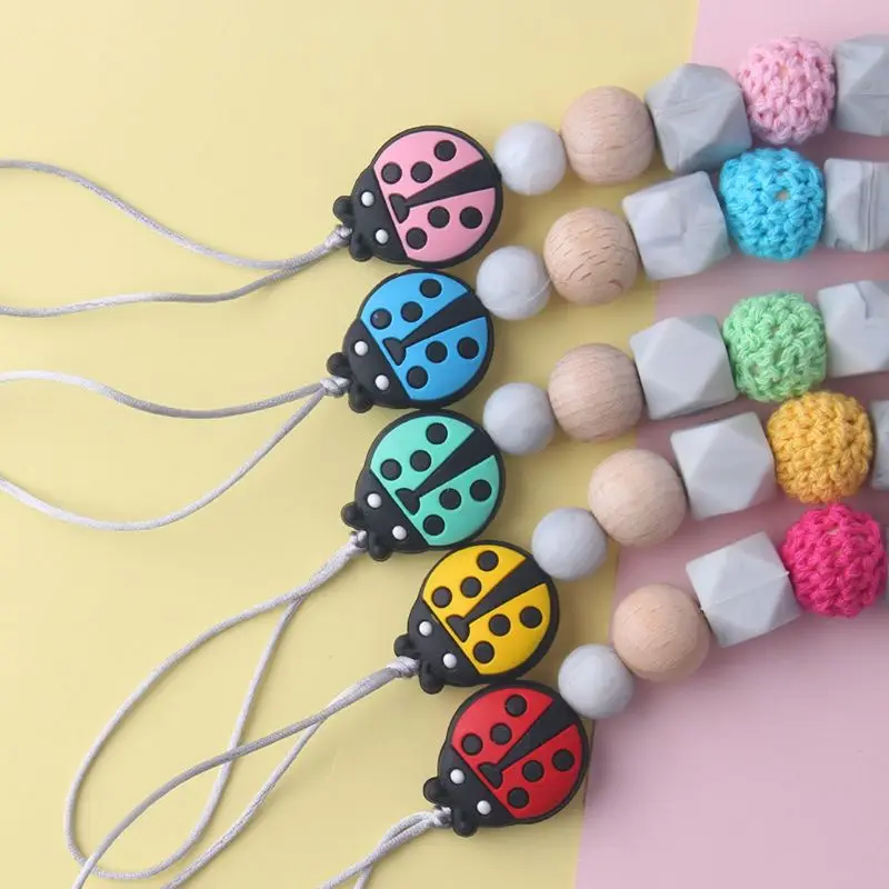 

Silicone Pacifier Clip Wooden Bead Dummy Clip Holder Cute Ladybug Beads Pacifier Clips Soother Chains Baby Teething Toy