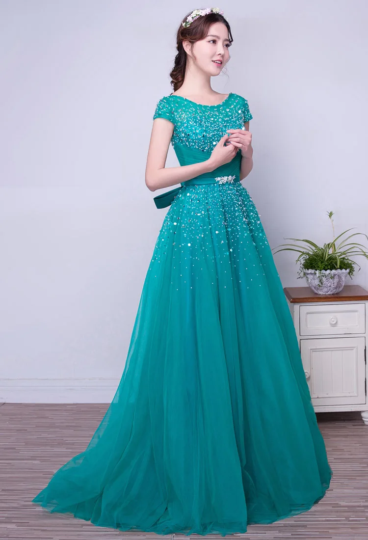 Бирюзовое фатиновое платье трапециевидной формы с длинными скромное на