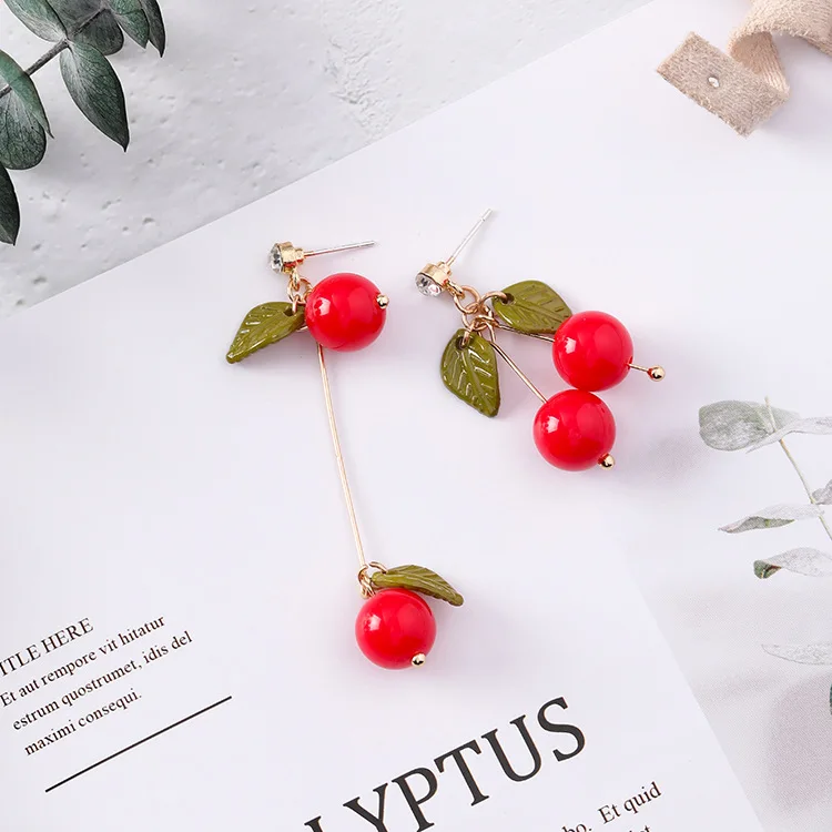 Женские Золотые сережки Необычные асимметричные серьги с зелеными листьями и