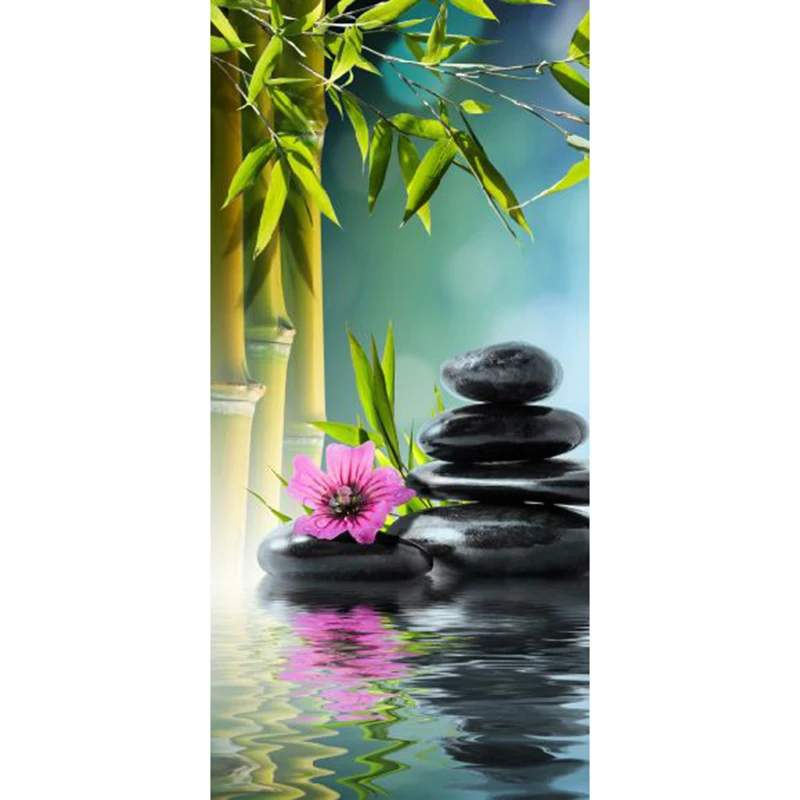 Бамбуковые и черные камни в воде картинка наклейки на дверь обои украшение для