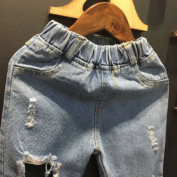 2017 весна голубой рваные джинсы для детей отверстие джинсовые брюки корейский