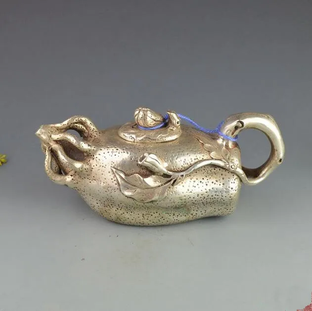 

China collection archaize white copper ginseng teapot craft statue