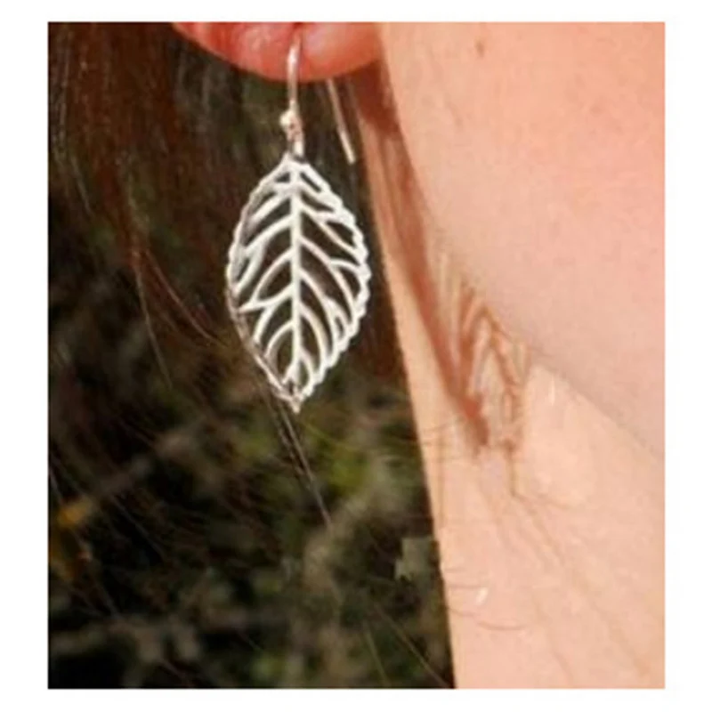 

Original New Fashion Gold Hollow Leaf Drop Earring For Women Silver color Leaf Dangle Earring Female Brincos Bijoux Jewelry Gift